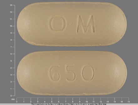 OM 650 yellow capsule shaped pill
