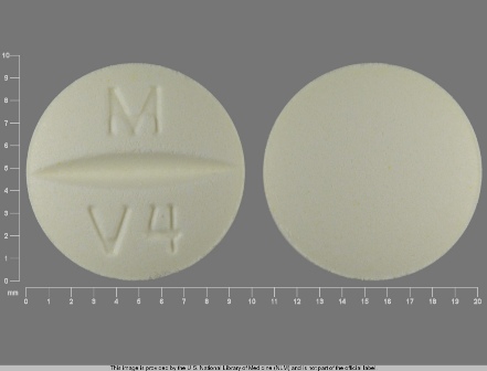 M V4 pale yellow round tablet