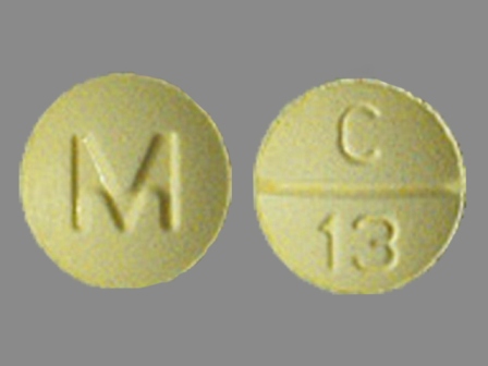 M C 13 Yellow Round Tablet