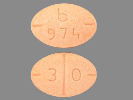b 974 3 0 orange oval tablet